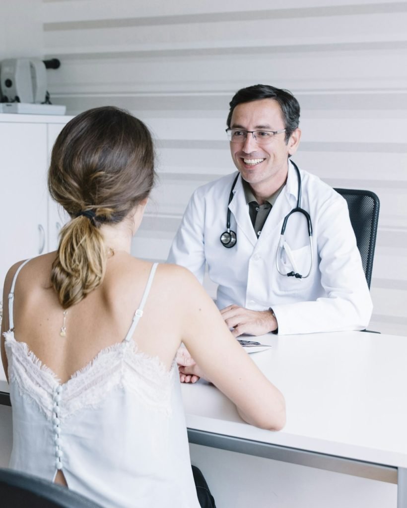 Male doctor with female patient